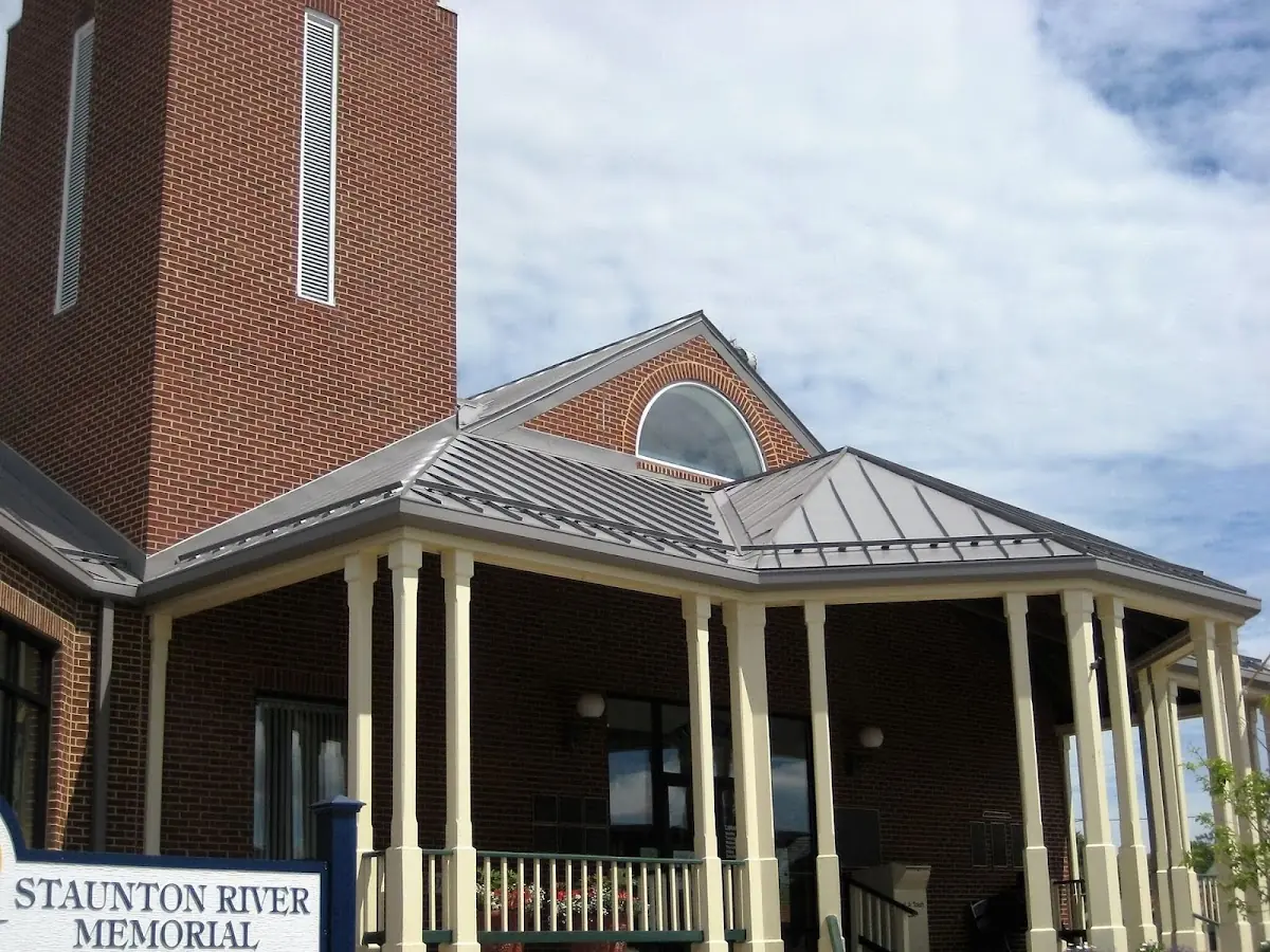 Skilled roofing craftsmen working on a residential roof in Artemas